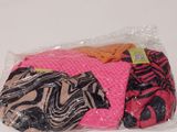 a bag of clothes sitting on a white surface