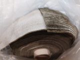 a close up of a roll of fabric in a plastic bag