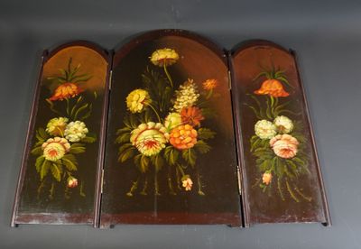 three panels with flowers painted on them hanging on a wall