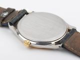 an image of a close up of a watch on a white surface