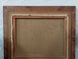 a picture of a picture frame sitting on a table next to a plant