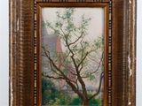 painting of a tree in a wooden frame on a shelf