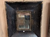 a picture of a mirror in the corner of a room