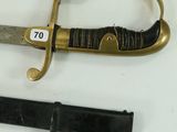 two different types of swords on display on a table