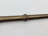 a close up of a metal object on a white surface