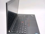 the laptop is open on a white surface with a black keyboard