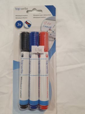 three pens that are in a package on a table