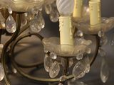 a chandelier that has a lot of crystals on it