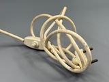 a white cord that is connected to an electrical plug