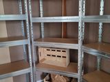 a room with a lot of shelves and boxes on the floor