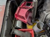 an image of a trash can with tools inside of it