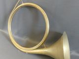 a brass instrument that is laying on a table