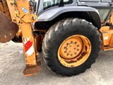 an image of a large wheel loader in a parking lot