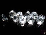 some very pretty white diamonds on a black surface