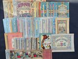 a lot of old books on display on a table