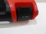 a close up of a red and black object on a table