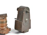 pair of antique wooden candlesticks on a white background