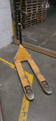 a pair of skis laying on the ground in a parking lot