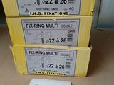 three boxes of fixing multis are stacked on top of each other