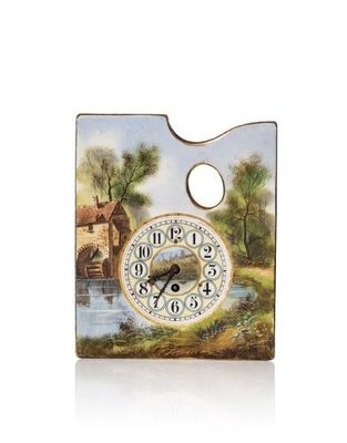 une horloge posée sur une feuille de papier