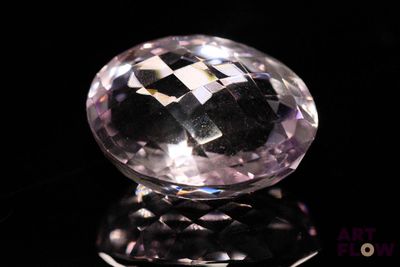 a crystal ball sitting on top of a black surface
