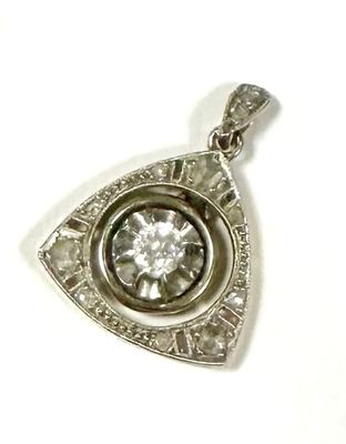 an image of a silver pendant with a diamond in the center