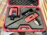 a tool in a case that is sitting on the floor