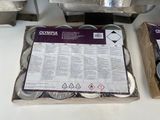 a box of silver coins sitting on a counter