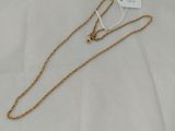 a gold chain with a heart charm on top of it