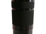 the camera lens is sitting on a white surface with a white background