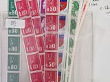 a lot of stamps on the table with a lot of notes