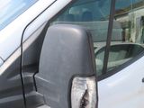 a white van that is parked on the side of the road