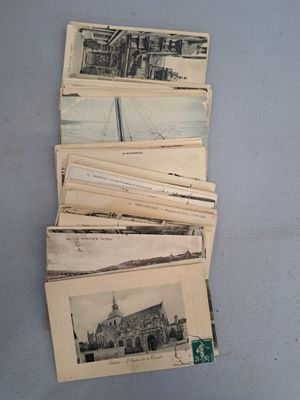 a lot of old postcards sitting on a table