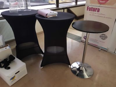 two tables that are sitting on the floor in front of a window