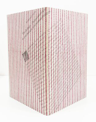 an image of a red and white striped book with writing on it
