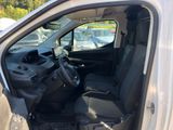 the interior of a van with the door open and the driver ' s seat down