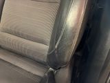a close up of a car seat with a black leather trim