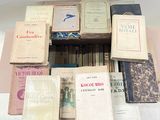 a lot of books that are sitting on a table