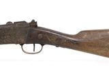 an old rifle with a wooden barrel on a white background