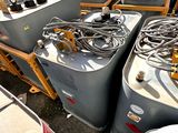 many different types of water tanks on the ground