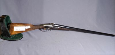 an old gun with a wooden handle on a white background