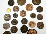 a close up of a bunch of coins sitting on top of a table