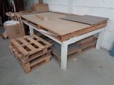 a table that has a lot of pallets on it
