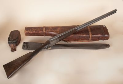 a gun, a knife, and a book on a table