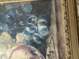a picture of a painting of a vase of fruit on a table