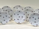 eight plates are arranged in a row on a white surface