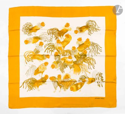 a close up of a yellow and white scarf with fish on it