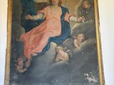 a painting on the wall of a room with a painting of jesus