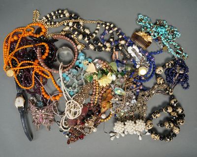 many different types of beaded necklaces on a table