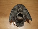 an image of a candle holder with a dragon on it